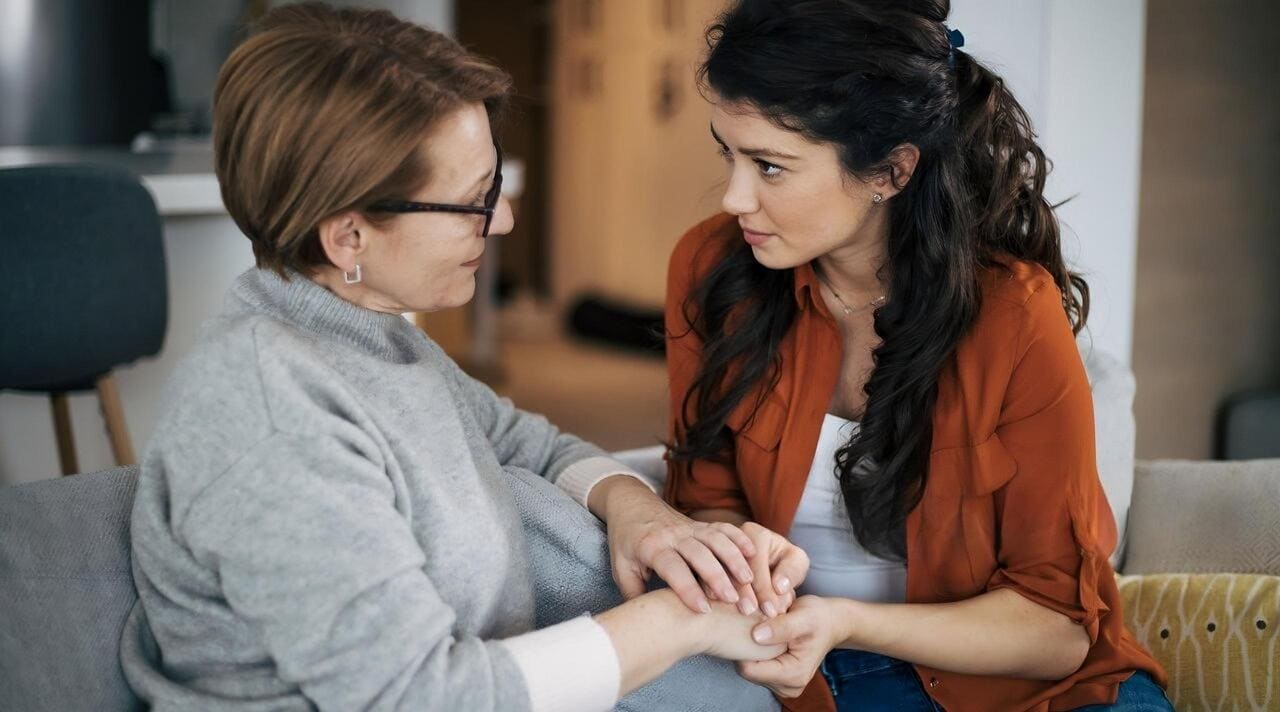 Image Placeholder: A calm, intimate setting where a person is setting personal boundaries with loved ones, perhaps through clear communication.